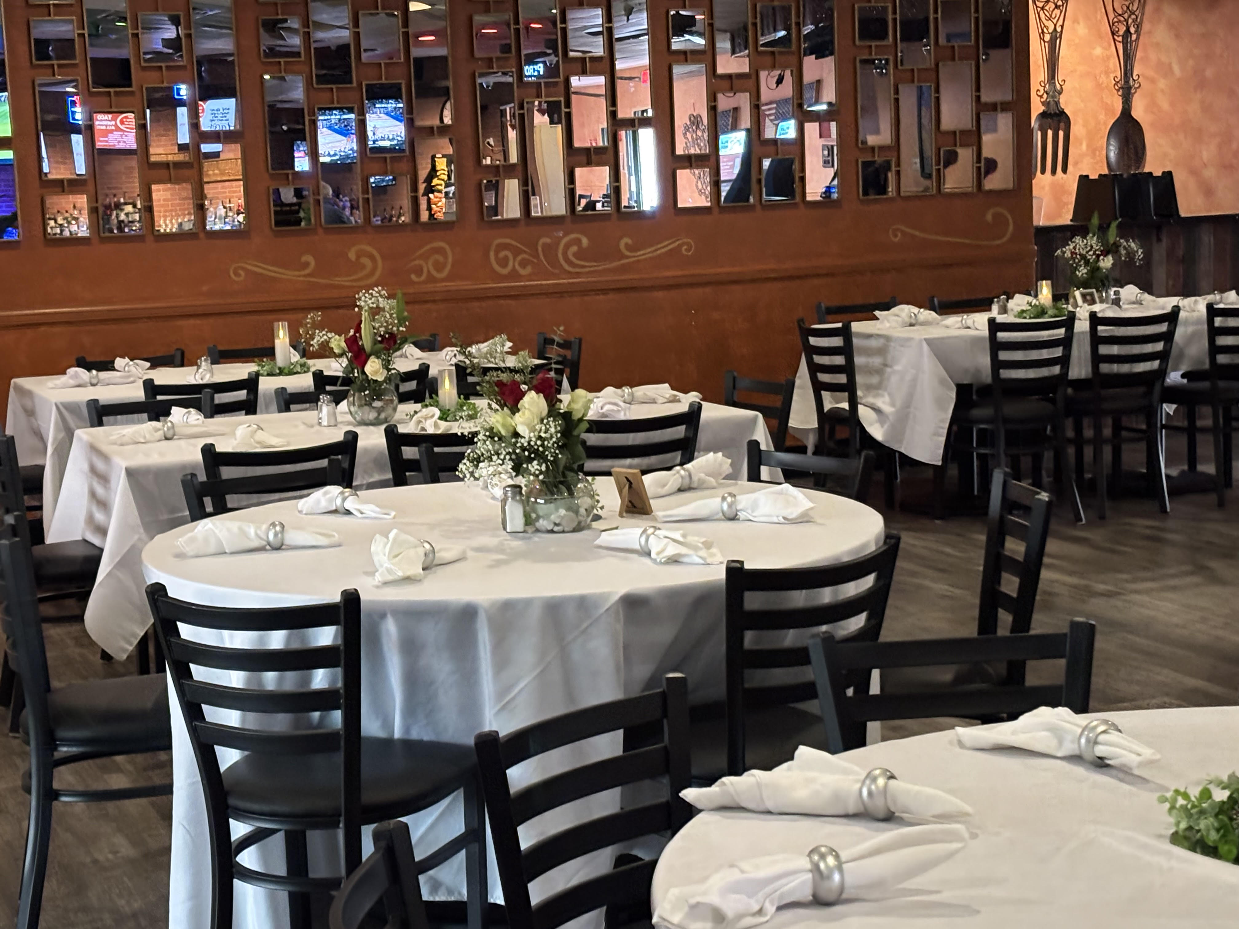 Banquet hall setup with tables and decorations